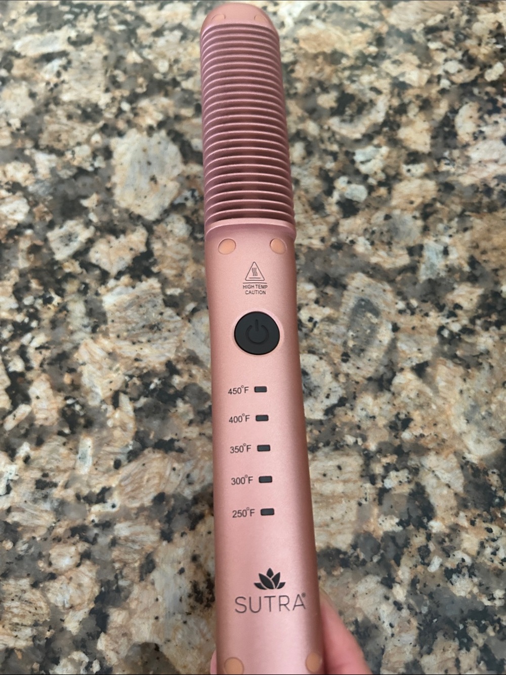 Sutra Hair Straightening brush. Sold out from website. Rose gold in color.